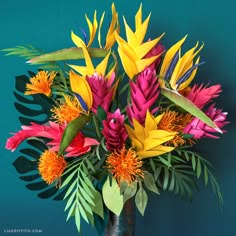 a vase filled with lots of colorful flowers