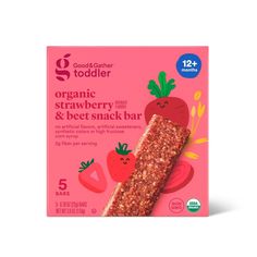 organic strawberry and beet snack bar on a pink background with the label for toddler