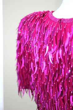 "Just such a Fun Stunning Dress this dress is pink and oh so fun!! With catail beads and sequins..this is just a fun dress to wear! I see no flaws, Very good to Excellent condition Measuring: 37\" long Bust: 36\" Waist: 30\" Hip: 36\" Shake shimmer and shine!! Pet Free/smoke free Enjoy!" Sequined Sleeveless Fancy Dress, Sleeveless Sequin Dress For Fancy Dress Occasions, Sleeveless Sequin Dress For Fancy Occasions, Summer Embellished Flapper Dress For Costume Party, Embellished Flapper Dress For Summer Costume Party, Pink Sequin Dress For Evening Party Season, Pink Sequin Dress For Evening And Party Season, Embellished Dresses For Carnival Costume Party, Party Season Pink Dress With Contrast Sequin