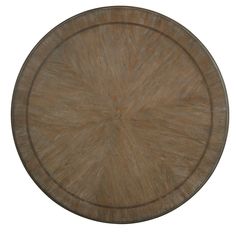 a round wooden table top with no one around it