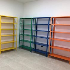 three shelves with different colors in a room