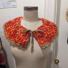 a close up of a mannequin wearing a crocheted collar