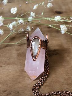 "This necklace feature a double terminated pink rose quartz point adorned with a beautiful silky sapphire gemstone. The pendant was electroformed with pure copper, oxidized with a dark patina, polished and finished with wax. ✨All my jewelry and designs are handmade by me with love and passion for art and nature✨ ︎>> NOTE: \"One of a Kind\" You'll receive this exactly piece  Created with: *double terminated pink pale rose quartz point *silky sapphire rose cut gemstone *pure copper *soldered antique copper chain *lobster clasp *pendant approx. 1 3/4\" inches *pendant is hanging from 17\" *please choose your desired length from 14-20 inches ︎>> ❀ ๑ ▲Rose Quartz It is known as the \"love stone\" as the message it emits is the strong vibration of unconditional love, joy, peace, warmth and heali Rose Gold Spiritual Crystal Gemstone Necklaces, Bohemian Electroformed Rose Gold Necklace, Copper Electroforming, Quartz Crystal Jewelry, Energy Jewelry, Quartz Crystal Pendant, Witchy Jewelry, Moonstone Jewelry, Copper Chain