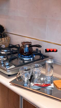 a stove top oven sitting inside of a kitchen