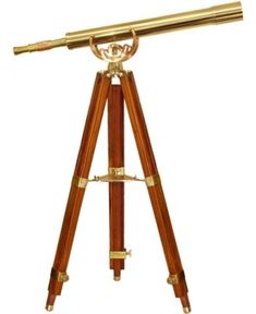 an antique telescope with wooden tripod legs and brass plated body, on a white background