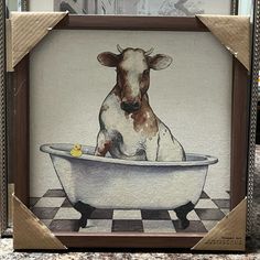 a painting of a cow sitting in a bathtub with rubber ducky on the side