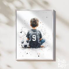 a watercolor painting of a young boy sitting on the ground with a soccer ball