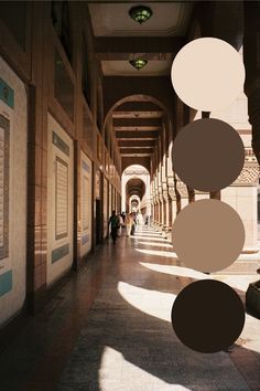 an image of a hallway with people walking down the length and shadows on the floor