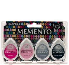 three different colors of mementoo ink in a package on a white background with polka dots