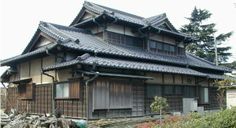 an old japanese house with wooden shutters