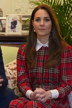 the duke and duchess of cambridge are sitting on a couch