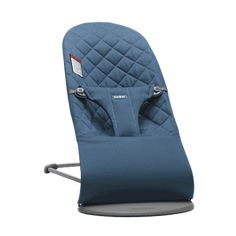 a blue baby seat that is attached to the back of a child's chair