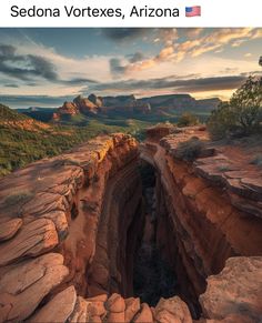 an open hole in the side of a mountain with trees and mountains in the background