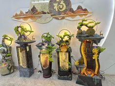 a group of vases with plants in them