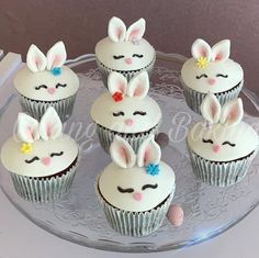 cupcakes decorated with bunny ears on a glass plate