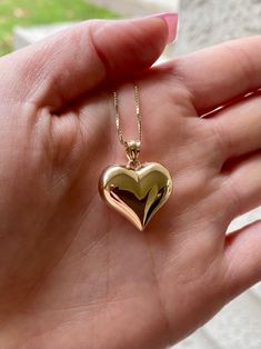 14k beautiful gold puffed heart love pendant. Material: Genuine 14k solid gold. Length: From top the bail to the bottom of the heart is approximately 1 inch long. Width: Approximately .80 inches wide. Weight: approximately 2.1 grams. *Chain sold separately* chains purchased with this order is approximately 1.5 grams* Comes in a nice box. 14k Gold Polished Heart Pendant Necklace, 14k Gold Pendant Heart Necklace With Polished Finish, 14k Gold Heart Pendant Necklace For Anniversary, 14k Gold Polished Finish Heart Necklace, 14k Gold Heart Necklace With Polished Finish, Polished 14k Gold Heart Necklace, 14k Gold Heart Necklace With Charms, 14k Heart Pendant Necklace For Valentine's Day, 14k Stamped Heart Pendant Necklace For Valentine's Day