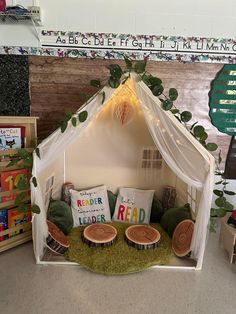 an indoor play tent with cushions and pillows