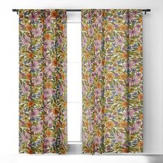 an open window with floral curtains hanging on the side and one curtain in front of it