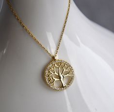 "10k 14k 18k Gold Tree of Life Necklace, Tree Necklace, Life Tree Pendant, Family Necklace,Tree of Life Charm,Christmas Gift,Mothers Day Gift Tree of Life For centuries, the Tree of Life, a highly symbolic design for many cultures around the world, has become very popular in jewellery. This popularity is increasing day by day.  A universal symbol found in almost every spiritual and cultural tradition of the world, the Tree of Life has many meanings besides being known as a symbol of immortality.  The tree of life design is a large tree with roots and branches enclosed in a circle. The roots of the tree reflect the spreading branches, providing balance and symmetry. All jewelry in our collection are real solid gold and completely handmade accessories. The jewelry in our collection, which is White Gold Tree Of Life Jewelry As Gift, Tree Of Life Round Jewelry For Anniversary, Elegant White Gold Tree Of Life Jewelry, Elegant Tree Of Life Necklace For Anniversary, 14k Gold Tree Of Life Jewelry Gift, Elegant Tree Of Life Jewelry For Anniversary, Elegant Yellow Gold Tree Of Life Necklace, Elegant Yellow Gold Tree Of Life Jewelry, Elegant Gold Tree Of Life Jewelry