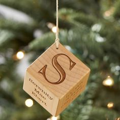 a wooden ornament hanging from a christmas tree