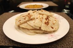 there are some pita bread on the plate