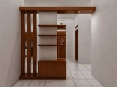 an empty room with white tile flooring and wooden shelves