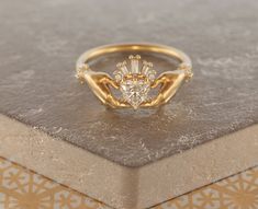 a diamond ring sitting on top of a table