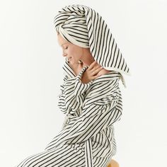 Your new favorite robe: plush, eco-friendly, and effortlessly stylish. Crafted from chemical-free 100% cotton with chic black stripes, it's the epitome of relaxation. Two hidden side pockets, a snug waist tie, and a cozy shawl collar make this limited-edition piece the ultimate in comfort and sophistication! Made in Turkiye! SIZE S/M: 4-6-8 L/XL: 10-12 MODEL SIZE: 4 - 6 Cozy Shawl, Terry Towel, British Indian, Chemical Free, Papua New Guinea, Equatorial Guinea, Shawl Collar, Hand Towel, Brunei