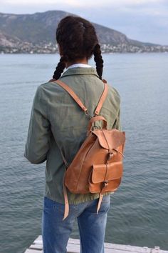 Real Leather Backpack in Beige Natural Color with adjustable straps. Perfect for gift. Stylish and durable. Please note all natural leather products will darken with time. Dimensions of the bags: Small: 24×30×12 cm Med: 28×34×15 cm Large: 36×40×20 cm All Bags are made to order. If you like this bag, please see our full collection in the below link: https://www.etsy.com/shop/madammeshushu?section_id=17490770&ref=shopsection_leftnav_3 More on who we are Welcome to my store where you will find Casual Rectangular Backpack For Adventure, Backpack With Adjustable Strap, Outdoor Leather Backpack With Adjustable Strap, Casual Satchel Bag For Adventure, Large Capacity Satchel For Adventure, Back To School Leather Shoulder Backpack, Daily Use Satchel Backpack, Casual Adventure Backpack, Outdoor Satchel Backpack