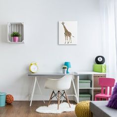 a room with a desk, chair and shelves on the wall next to each other