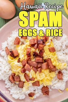 a plate with rice, eggs and ham on it