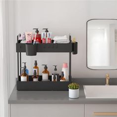 a bathroom counter with soaps, lotions and other personal care items on it