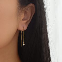 Sleek and contemporary, this pair of threader earrings feature a shiny gold chain from which hangs tiny but brilliant cubic zirconia charm. This listing is for a pair of earrings. All materials are 14K gold filled and are tarnish resistant, water resistant, and hypoallergenic. Gift box included with purchase. Chain measures 8 cm long with a 20 gauge. Cz measures 3.8mm in diameter --------------------♥ PROMOS ♥-------------------- Want 10% off? Join the mailing list by visiting http://bit.ly/vede Minimalist Dangle Linear Earrings As Gift, Dainty Drop Hoop Earrings With Adjustable Chain, Everyday Dangle Threader Earrings With Adjustable Chain, Gift Linear Drop Earrings With Adjustable Chain, Dangle Linear Earrings With Adjustable Chain As Gift, Teardrop Threader Single Earring As Gift, Everyday Linear Dangle Earrings With Adjustable Chain, Adjustable Dangle Linear Earrings As Gift, Dainty Dangle Threader Earrings