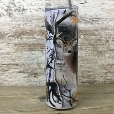 thermos cup is decorated with an image of a deer