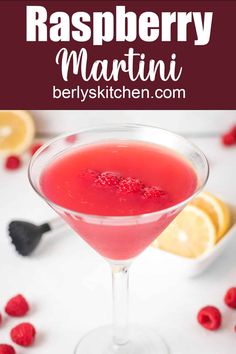 raspberry martini in a coupe glass garnished with fresh raspberries