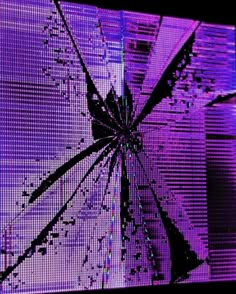 an image of a broken screen with purple light in the background and black lines on it