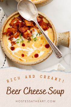 a bowl of beer cheese soup with bacon and cream in the center on a white background