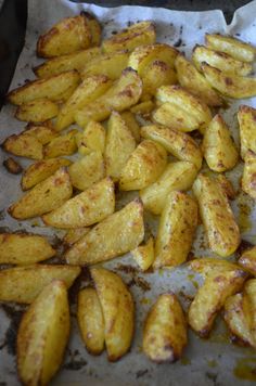 some fried potatoes are on a baking sheet