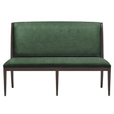 a green couch sitting on top of a wooden frame