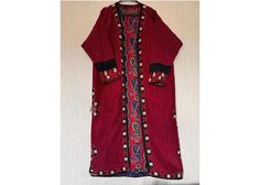 Add a unique and exotic touch to your wardrobe with this antique Turkmen silk kaftan, also known as a kimono or chapan. This original piece from the 1960s is a great addition to any collection. It is made from hand-woven silk and cotton fabrics used as lining. All embroidery is in silk. Used. Showcasing vibrant and colorful Turkmen regional design. The multicolored silk material adds a luxurious touch to the piece. Perfect for cultural events, this Turkmen traditional garment is a must-have for Traditional Silk Tunic Kaftan, Traditional Red Kaftan Straight Kurta, Red Embroidered Silk Kaftan, Traditional Silk Kaftan With Resham Embroidery, Silk Kaftan With Floral Embroidery And Long Sleeves, Bohemian Kaftan With Floral Embroidery And Traditional Drape, Traditional Tunic Abaya With Floral Embroidery, Traditional Embroidered Abaya, Traditional Abaya With Intricate Embroidery