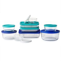 a stack of glass containers with lids and spoons