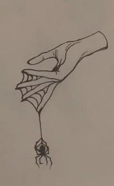 a drawing of a hand holding a spider on it's back with its claws extended