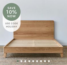 a wooden bed frame with the text save 10 % now use code holiday