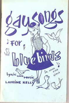 an old book with blue writing on the front and back cover, featuring a girl in a