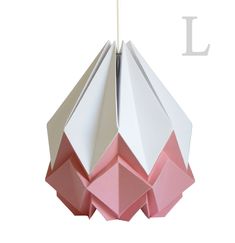 a pink and white origami light hanging from a ceiling fixture with the letter l on it