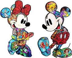 two mickey mouses are standing next to each other with different designs on their faces