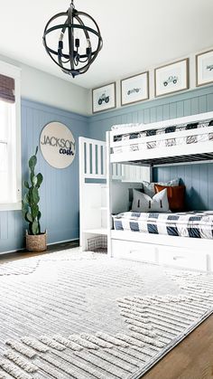 a bedroom with bunk beds and blue walls