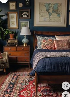 a bed room with a neatly made bed and lots of pictures on the wall above it