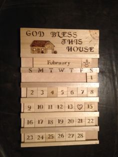 wooden calendars are stacked on top of each other with the words god sees this house