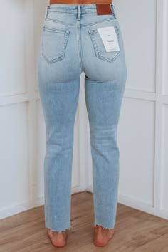 Details: Tracey Hidden Jeans High Rise No Distressing Straight Leg Fading/Whiskering Raw Edge Frayed Hems Zip Fly Button Closure Shorter Length Good Stretch Available in Light Wash Rise: 11" Inseam: 28" Leg Opening: 12" Material: 93% Cotton, 5% Polyester, and 2% Spandex We are recommending true to size! *Tracey is the fit of the jeans. Tracey jeans may differ in wash/look/distressing Wild Oak Boutique, Women’s Jeans, Jeans Summer Outfit, Cute Mom Outfits, Light Jeans Outfit, Hidden Jeans, Good Jeans, Light Jeans, Womens Jeans